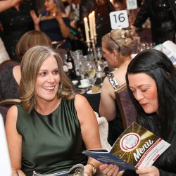 Guests seated at the Pilgrim’s Europe table for dinner.